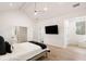 Bright main bedroom featuring a vaulted ceiling, a ceiling fan, and hardwood floors at 185 Pebble Trl, Alpharetta, GA 30009