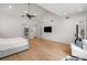 Spacious main bedroom features wood floors and large windows for natural light at 185 Pebble Trl, Alpharetta, GA 30009