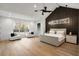 Spacious main bedroom features a custom accent wall and large windows at 185 Pebble Trl, Alpharetta, GA 30009