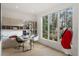 Bright office with built in cabinets and shelving looks out on a green view at 185 Pebble Trl, Alpharetta, GA 30009