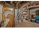Utility room with shelving, exposed pipes, and concrete floors at 3327 Spring Meadow Ct, Tucker, GA 30084