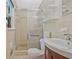 Bathroom featuring a tiled shower, vanity with sink, and ample natural light at 3327 Spring Meadow Ct, Tucker, GA 30084