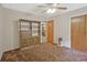 Bedroom showcasing built-in storage, closet, and view into the next room at 3327 Spring Meadow Ct, Tucker, GA 30084