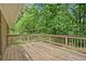 Spacious wooden deck offers serene views of the surrounding lush greenery and trees at 3327 Spring Meadow Ct, Tucker, GA 30084