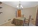 Cozy dining area featuring classic chandelier and view of doorway at 3327 Spring Meadow Ct, Tucker, GA 30084