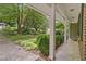 Well-maintained front yard with lush greenery and a covered porch at 3327 Spring Meadow Ct, Tucker, GA 30084