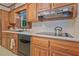 Functional kitchen with wood cabinets, modern appliances, and ample counter space at 3327 Spring Meadow Ct, Tucker, GA 30084