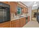 Well-maintained kitchen with wood cabinets, modern appliances, and a view into living room at 3327 Spring Meadow Ct, Tucker, GA 30084