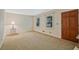 Cozy living room with hardwood door, neutral carpet, and natural light at 3327 Spring Meadow Ct, Tucker, GA 30084