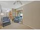 Bright and airy living room featuring two armchairs, and connecting rooms at 3327 Spring Meadow Ct, Tucker, GA 30084
