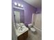 Bathroom featuring lilac-painted walls, a sink vanity, and a shower-tub combo at 384 Daniel Mill Xing, Villa Rica, GA 30180