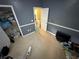 Bedroom with carpet, gray walls, chair railing, and closet, offering plenty of space to relax and unwind at 384 Daniel Mill Xing, Villa Rica, GA 30180