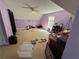 Large bedroom with ceiling fan, neutral carpet and lavender colored walls at 384 Daniel Mill Xing, Villa Rica, GA 30180