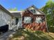 Two story home featuring a partial brick facade, complemented by well-maintained windows and shutters at 384 Daniel Mill Xing, Villa Rica, GA 30180
