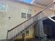 Two-story home exterior with wooden stairs leading to the second level at 384 Daniel Mill Xing, Villa Rica, GA 30180