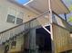 The wooden deck with railings and stairs leading down to the yard for outdoor enjoyment at 384 Daniel Mill Xing, Villa Rica, GA 30180