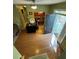 View of the foyer and the dining room, showcasing the front door, hardwood floors, and inviting living space at 384 Daniel Mill Xing, Villa Rica, GA 30180