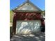 Oversized garage with brick exterior offers convenient parking at 384 Daniel Mill Xing, Villa Rica, GA 30180