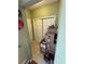 Hallway with bi-fold doors shows the potential for ample storage at 384 Daniel Mill Xing, Villa Rica, GA 30180