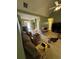 View of the living room with a ceiling fan and access to an outdoor patio at 384 Daniel Mill Xing, Villa Rica, GA 30180