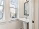 Bathroom featuring a pedestal sink, a mirror, and a natural light from a window at 621 Broadview Ne Ter, Atlanta, GA 30324