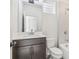 Bathroom with stylish vanity, a tiled shower-tub combo, and updated fixtures at 621 Broadview Ne Ter, Atlanta, GA 30324