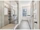 Bathroom with glass enclosed shower and white cabinets at 621 Broadview Ne Ter, Atlanta, GA 30324