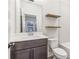 Modern bathroom boasts updated vanity and floating shelves at 621 Broadview Ne Ter, Atlanta, GA 30324
