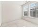 Bright bedroom with white walls, neutral carpet, and two windows that provide natural light at 621 Broadview Ne Ter, Atlanta, GA 30324