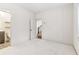 Bright bedroom with an ensuite bathroom and stairs seen through the door at 621 Broadview Ne Ter, Atlanta, GA 30324