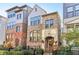 Elegant two-story townhome featuring a brick facade and manicured landscaping at 621 Broadview Ne Ter, Atlanta, GA 30324