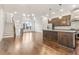 Open-concept living area with views into the kitchen, featuring stainless steel appliances at 621 Broadview Ne Ter, Atlanta, GA 30324