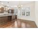 Bright kitchen with stainless steel appliances, custom cabinetry, and a view of the outdoor patio at 621 Broadview Ne Ter, Atlanta, GA 30324