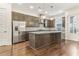 Modern kitchen featuring a large island, stainless steel appliances, and custom cabinets at 621 Broadview Ne Ter, Atlanta, GA 30324