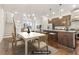 Staged kitchen and dining area featuring stainless steel appliances and modern fixtures at 621 Broadview Ne Ter, Atlanta, GA 30324