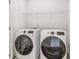 Laundry room featuring a washer, dryer, and wire shelving at 621 Broadview Ne Ter, Atlanta, GA 30324