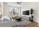 Staged living room featuring hardwood floors, modern furniture, and a cozy atmosphere at 621 Broadview Ne Ter, Atlanta, GA 30324