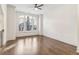Spacious, bright living room with gleaming hardwood floors and a large window at 621 Broadview Ne Ter, Atlanta, GA 30324