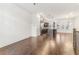 Spacious open floor plan with dark hardwood floors connecting the kitchen and living areas at 621 Broadview Ne Ter, Atlanta, GA 30324