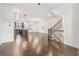 Open-concept living space with dark hardwood floors and a staircase at 621 Broadview Ne Ter, Atlanta, GA 30324