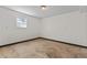 The unfinished basement has a window to let in the light at 6418 Briarwood Ct, Riverdale, GA 30296
