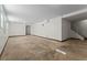 Finished basement offers stairs to main level, white paint and room for customization at 6418 Briarwood Ct, Riverdale, GA 30296