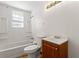 This bathroom features a tub and shower combination and a wood-tone vanity at 6418 Briarwood Ct, Riverdale, GA 30296