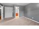 This bedroom offers great closet space, neutral paint, and carpeted floors at 6418 Briarwood Ct, Riverdale, GA 30296