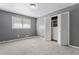 Bedroom with closet with built-in storage, carpet flooring and natural light at 6418 Briarwood Ct, Riverdale, GA 30296