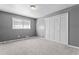 This bedroom features neutral paint, natural light and closet at 6418 Briarwood Ct, Riverdale, GA 30296