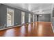Bright and airy living room with hardwood floors and large windows at 6418 Briarwood Ct, Riverdale, GA 30296