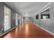 Spacious living room featuring gleaming hardwood floors and natural light at 6418 Briarwood Ct, Riverdale, GA 30296