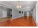 Open-concept living area with hardwood floors seamlessly connecting to other spaces at 6418 Briarwood Ct, Riverdale, GA 30296
