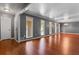 Open concept living room with hardwood floors, neutral paint and natural light at 6418 Briarwood Ct, Riverdale, GA 30296